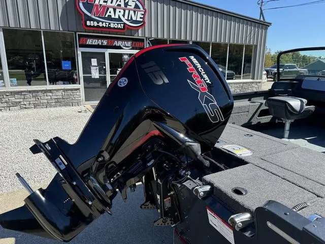 Slide: The Image of 2025 Lund 1775 Adventure Sport with Mercury Pro XS engine at a marine dealership. - 3