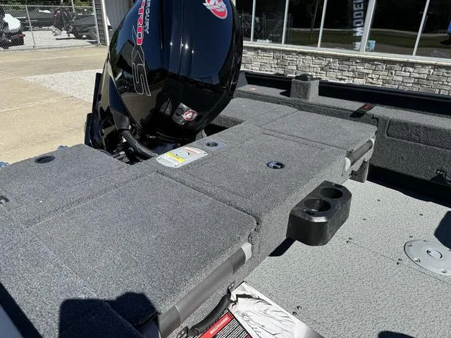 Slide: The Image of 2025 Lund 1775 Adventure Sport boat with outboard motor, gray interior, and storage compartments. - 6