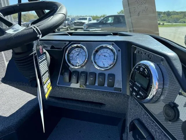 Slide: The Image of 2025 Lund 1775 Adventure Sport dashboard with gauges and controls. - 7