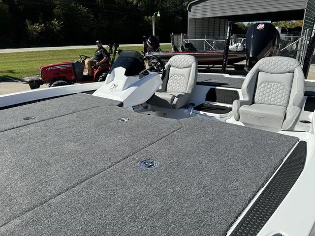 Slide: The Image of 2025 iKon VLX 20 boat with gray seating and spacious deck. - 16