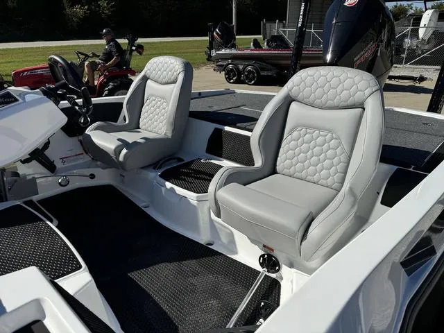 Slide: The Image of 2025 iKon VLX 20 boat interior with two gray cushioned seats. - 17