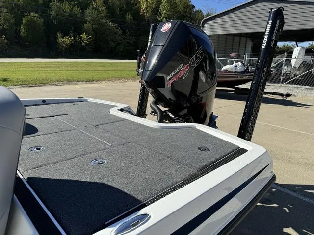 Slide: The Image of iKon VLX 20 boat with Mercury Pro XS engine, 2025 model, parked outdoors. - 19