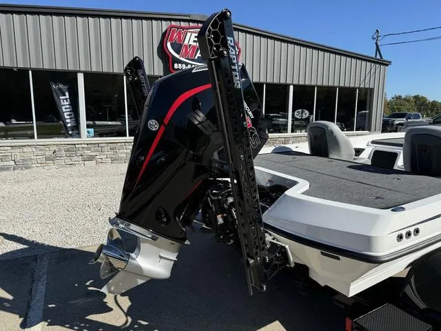 Slide: The Image of 2025 iKon VLX 20 boat with powerful outboard motor displayed outside dealership. - 3
