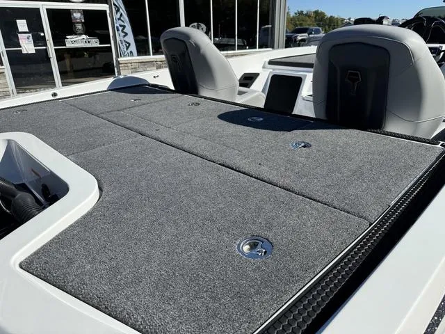 Slide: The Image of 2025 iKon VLX 20 boat with gray carpeted deck and sleek seating. - 5