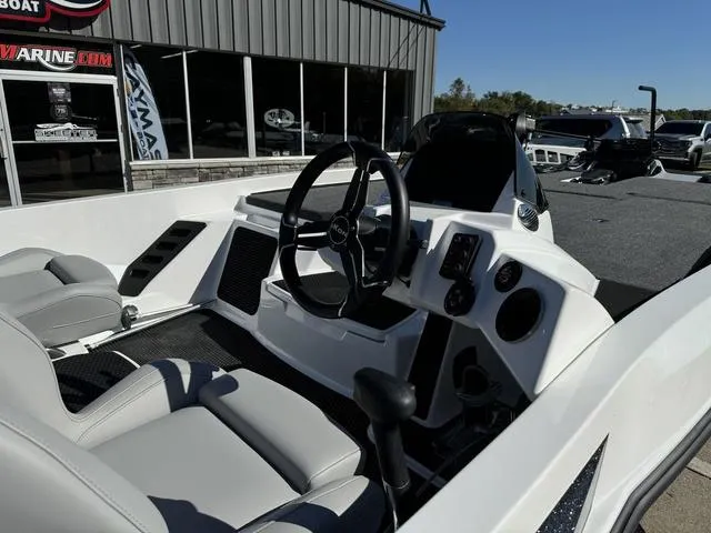 Slide: The Image of 2025 iKon VLX 20 boat interior with steering wheel and dashboard controls. - 6