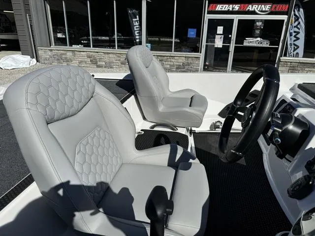 Slide: The Image of 2025 iKon VLX 20 boat interior with gray leather seats and steering wheel. - 7