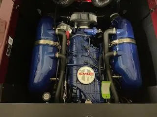 Slide: The Image of 2024 MasterCraft NXT22 engine with Ilmor branding, featuring blue components and intricate detailing. - 10
