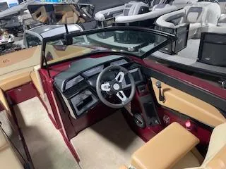 Slide: The Image of 2024 MasterCraft NXT22 boat interior with modern dashboard and steering wheel. - 8