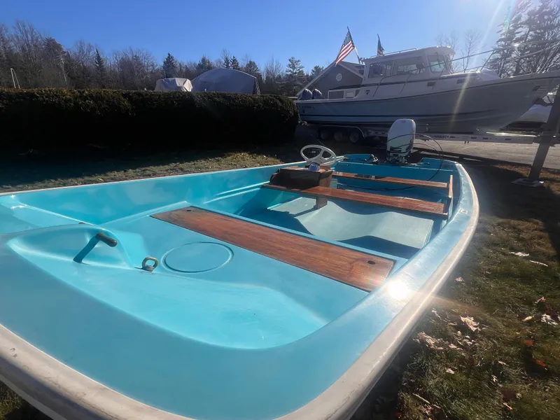 Slide: The Image of 1968 Boston Whaler 13 Sport boat with turquoise interior and wooden seats. - 8