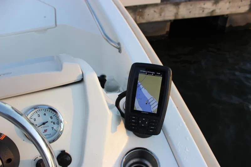 Slide: The Image of Dashboard of 2021 Boston Whaler 130 Super Sport with GPS and gauge. - 13