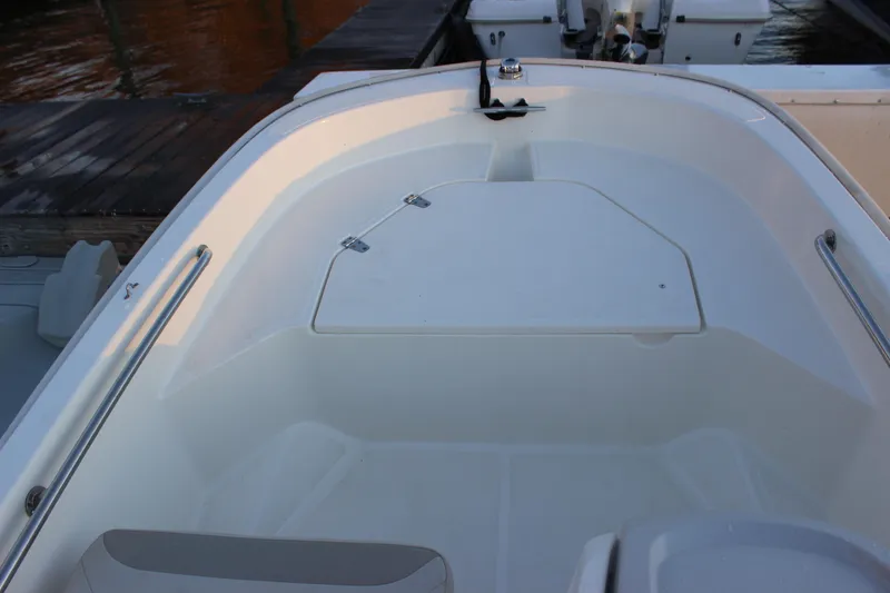 Slide: The Image of 2021 Boston Whaler 130 Super Sport boat interior with storage compartment. - 14