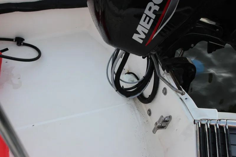 Slide: The Image of 2021 Boston Whaler 130 Super Sport boat with Mercury engine, interior view. - 19