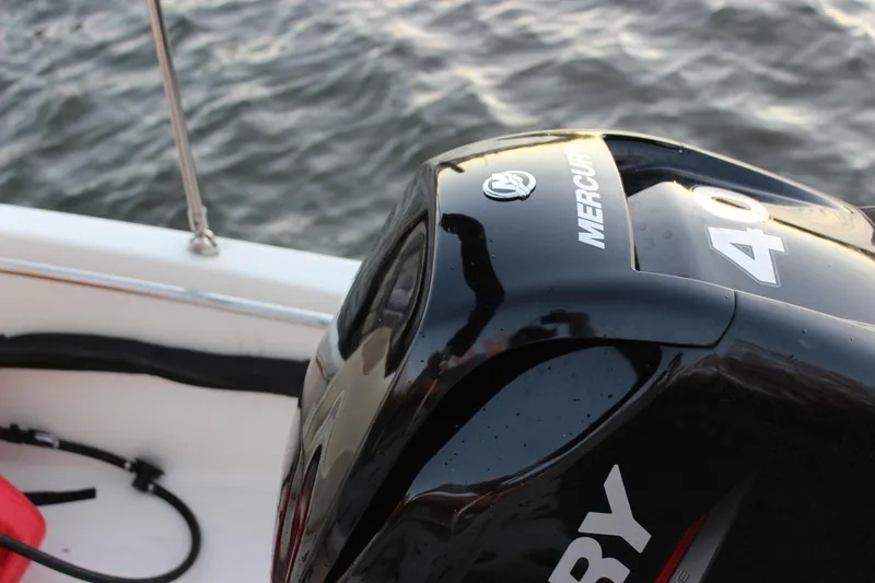 Slide: The Image of 2021 Boston Whaler 130 Super Sport with Mercury 40 engine on water. - 21