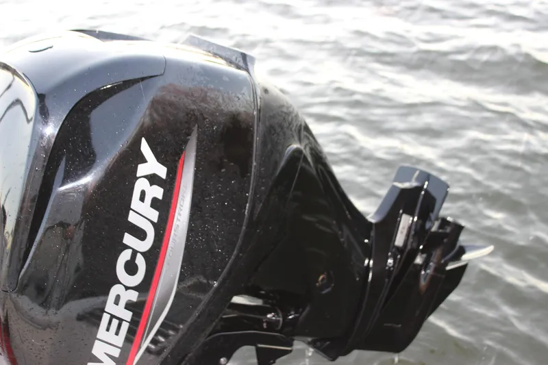 Slide: The Image of Mercury outboard motor on 2021 Boston Whaler 130 Super Sport, near water. - 22