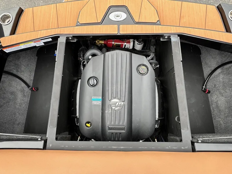 Slide: The Image of Engine compartment of 2025 Axis Wake Research T220 boat, featuring a modern inboard engine. - 19