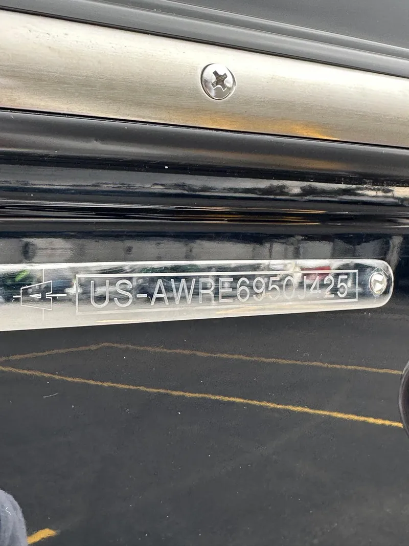 Slide: The Image of 2025 Axis Wake Research T220 boat identification plate with serial number. - 21