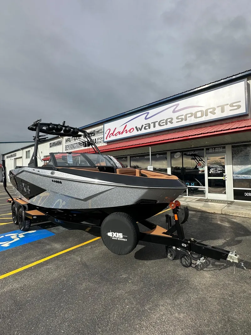 Slide: The Image of 2025 Axis Wake Research T220 boat at Idaho Water Sports dealership. - 4