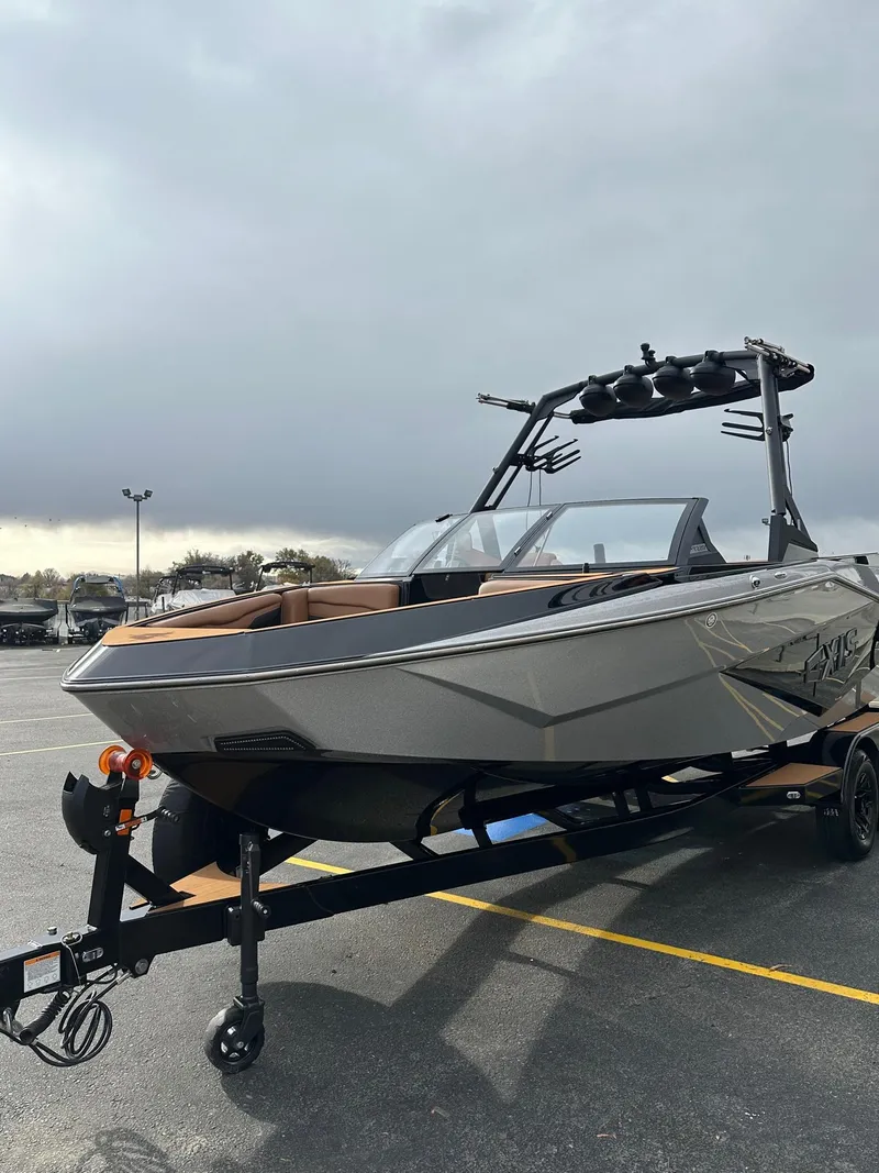 Slide: The Image of 2025 Axis Wake T220 on trailer, ready for adventure, with a sleek design and advanced features. - 6