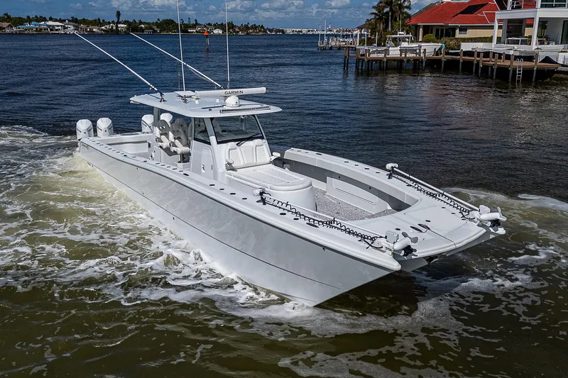 Slide: The Image of Freeman 47T 2023 boat cruising on a sunny waterfront. - 1