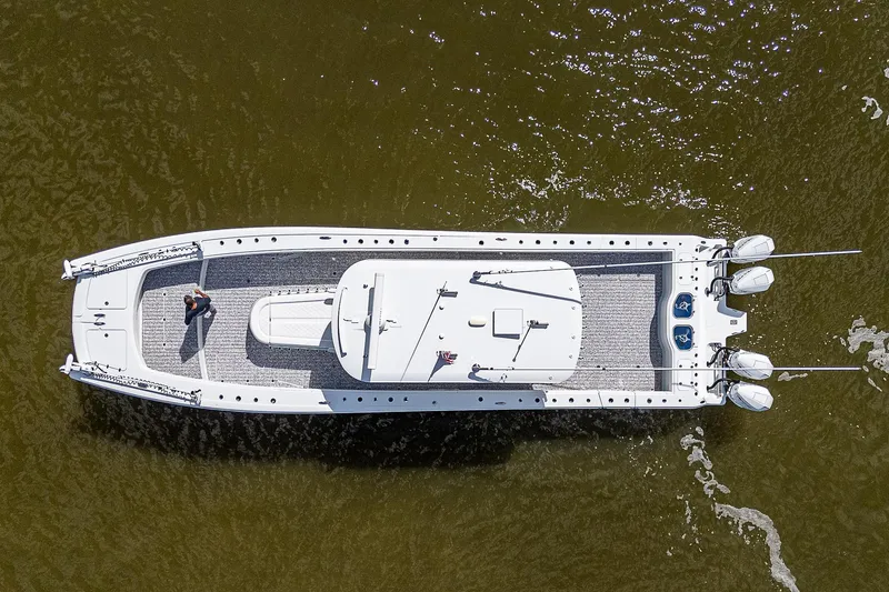 Slide: The Image of Aerial view of 2023 Freeman 47T boat cruising on water. - 11