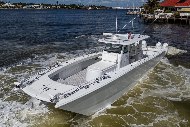 Slide: The Image of 2023 Freeman 47T boat cruising on a sunny day in a coastal area. - 3