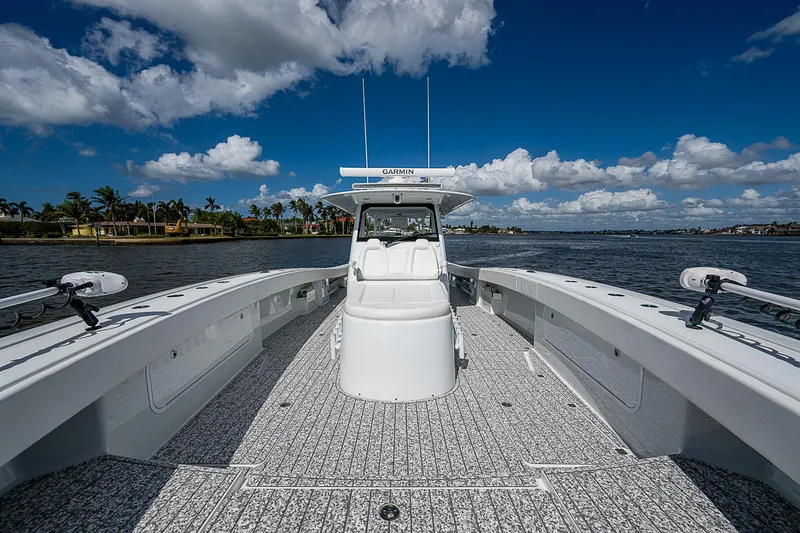Slide: The Image of Freeman 47T boat, 2023 model, on a sunny day with blue skies and water. - 30