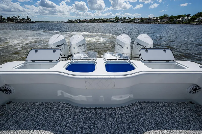 Slide: The Image of 2023 Freeman 47T boat with four powerful engines on a scenic waterway. - 36