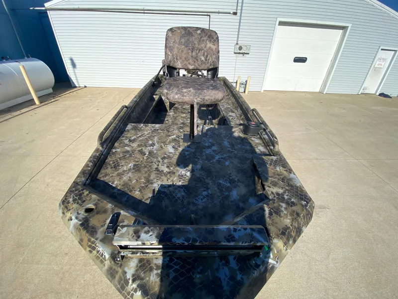 Slide: The Image of 2025 Excel 1854 F4 Shallow Water boat with camouflage design and swivel seat. - 10