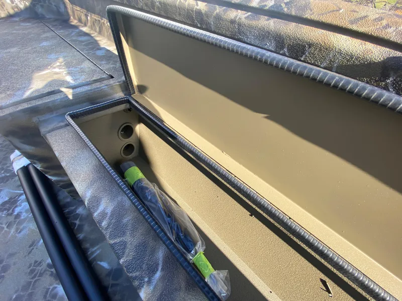 Slide: The Image of 2025 Excel 1854 F4 Shallow Water boat storage compartment with accessories. - 17