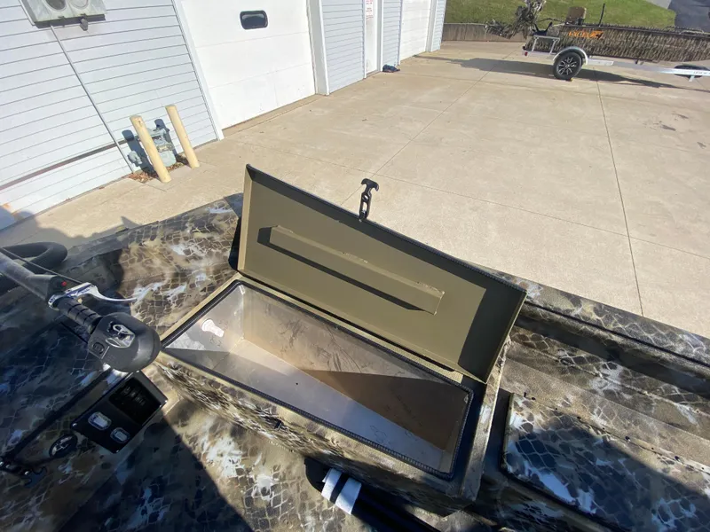 Slide: The Image of 2025 Excel 1854 F4 Shallow Water boat with open storage compartment. - 20