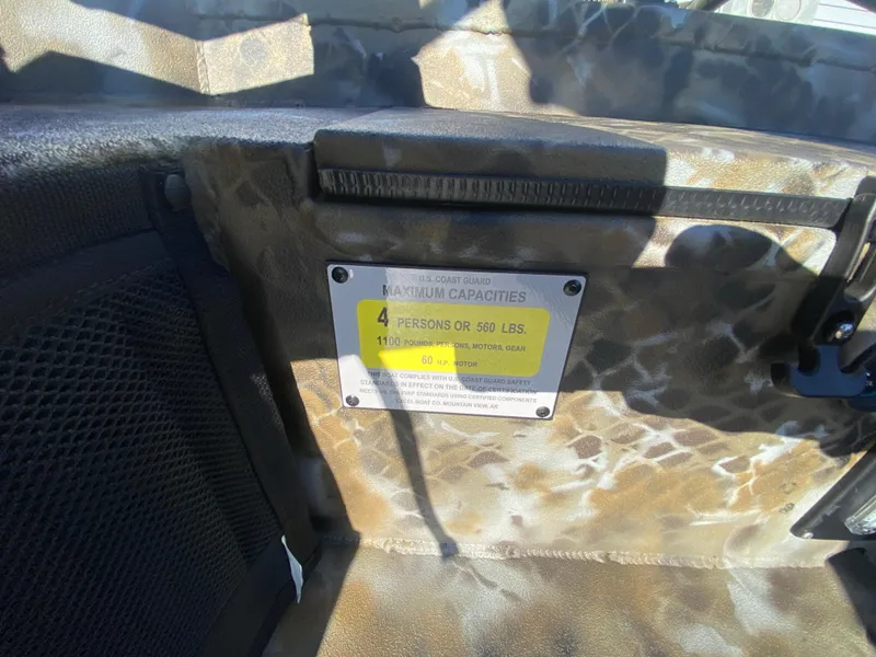 Slide: The Image of 2025 Excel 1854 F4 Shallow Water boat capacity label, 4 persons or 550 lbs. - 23