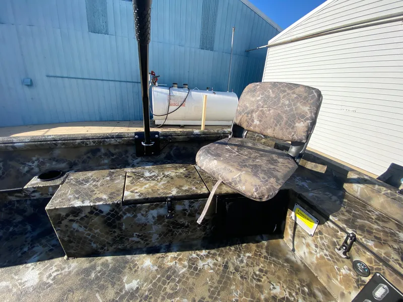 Slide: The Image of 2025 Excel 1854 F4 Shallow Water boat with camouflage seating and storage. - 24