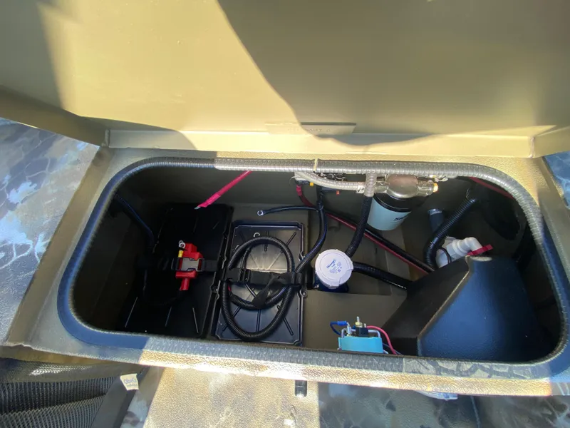 Slide: The Image of Open storage compartment of 2025 Excel 1854 F4 Shallow Water boat. - 27