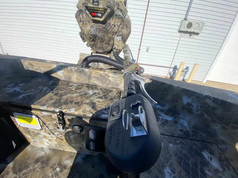 Slide: The Image of 2025 Excel 1854 F4 Shallow Water boat interior with camouflage design and control panel. - 29