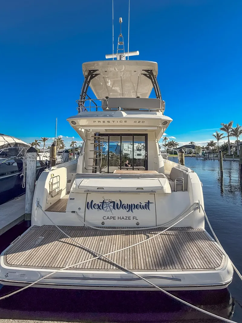 Slide: The Image of 2020 Prestige 420 Flybridge yacht docked in Cape Haze, Florida. - 1