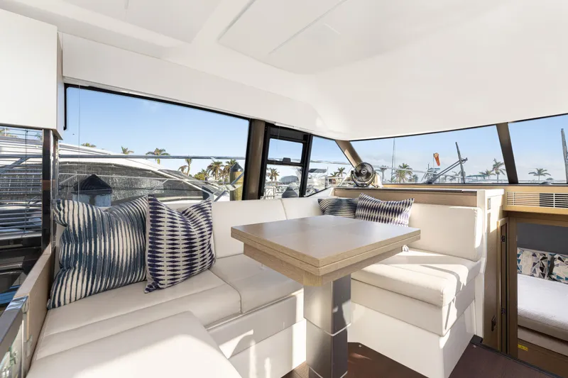 Slide: The Image of Luxurious interior of 2020 Prestige 420 Flybridge yacht with elegant seating and table. - 13