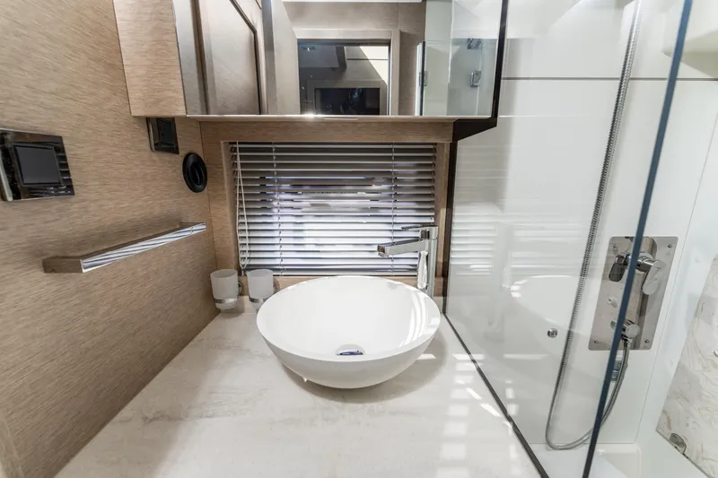 Slide: The Image of Luxurious bathroom in 2020 Prestige 420 Flybridge yacht with modern sink and sleek design. - 24