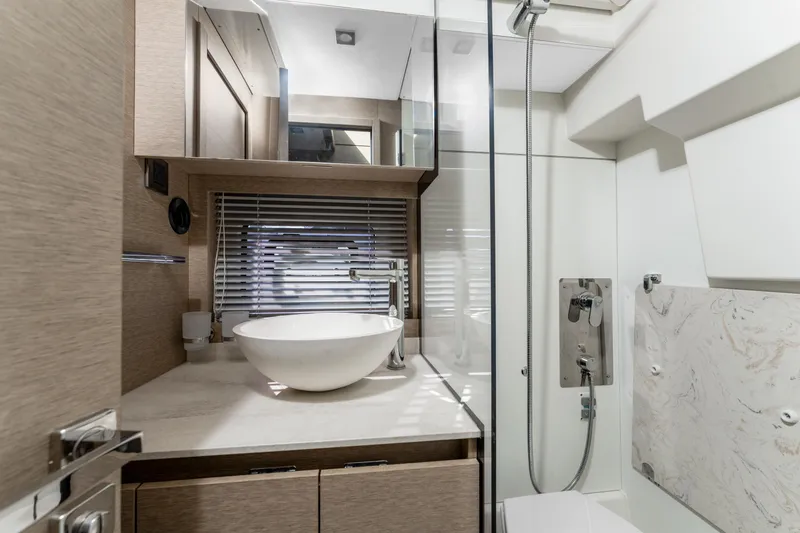 Slide: The Image of Luxurious bathroom in 2020 Prestige 420 Flybridge yacht with modern fixtures and elegant design. - 25