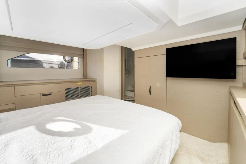 Slide: The Image of Luxurious bedroom interior of 2020 Prestige 420 Flybridge yacht with modern amenities. - 28