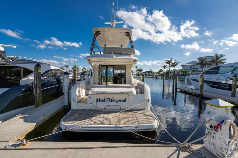 Slide: The Image of Prestige 420 Flybridge yacht docked at marina, 2020 model, sunny day. - 3