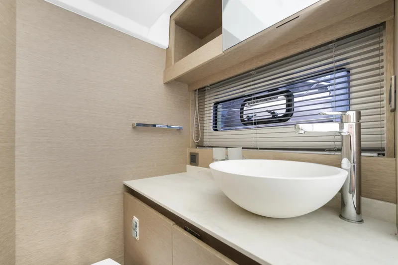 Slide: The Image of Modern bathroom in 2020 Prestige 420 Flybridge yacht with sleek design and vessel sink. - 33