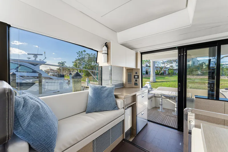 Slide: The Image of Luxurious interior of 2020 Prestige 420 Flybridge yacht with modern seating and scenic views. - 40