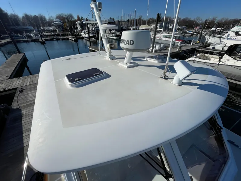 Slide: The Image of 2001 Grand Banks Eastbay 38 HX yacht deck with hatches, docked in a marina. - 15