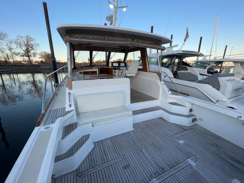 Slide: The Image of 2001 Grand Banks Eastbay 38 HX yacht with spacious deck and elegant interior. - 21