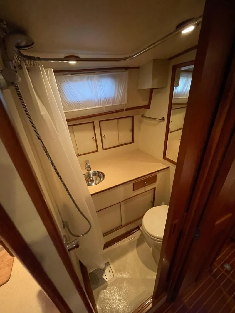 Slide: The Image of Luxurious cabin interior of 2001 Grand Banks Eastbay 38 HX yacht with cozy bedding. - 43