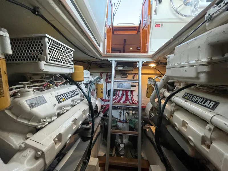 Slide: The Image of Engine room of 2001 Grand Banks Eastbay 38 HX with wiring and mechanical components. - 45