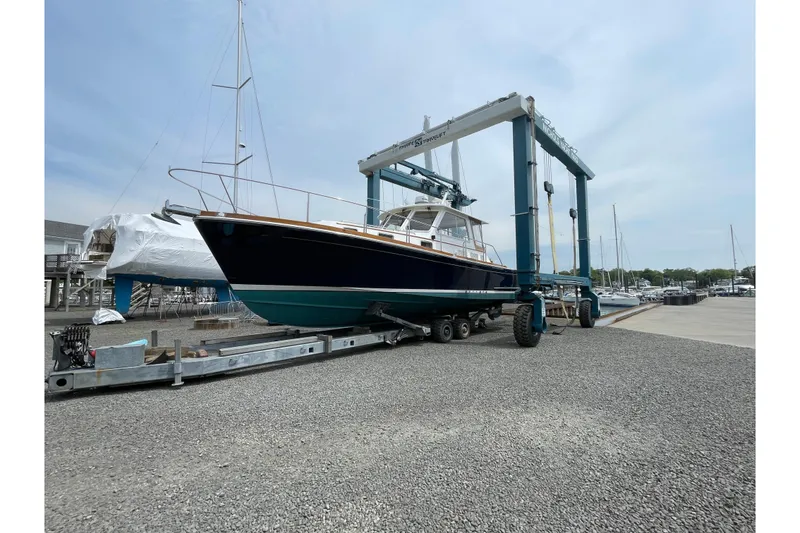 Slide: The Image of 2001 Grand Banks 38 Eastbay HX yacht on a trailer at a marina. - 47