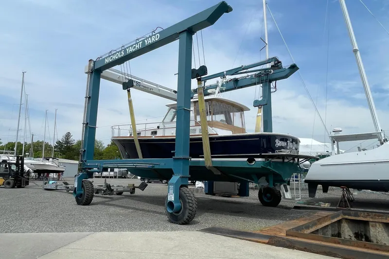 Slide: The Image of 2001 Grand Banks 38 Eastbay HX yacht in Nichols Yacht Yard, lifted by a travel lift. - 48