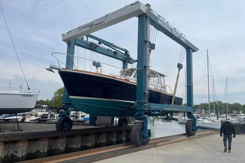 Slide: The Image of 2001 Grand Banks 38 Eastbay HX yacht in a boatyard lift at Nichols Yacht Yard. - 49