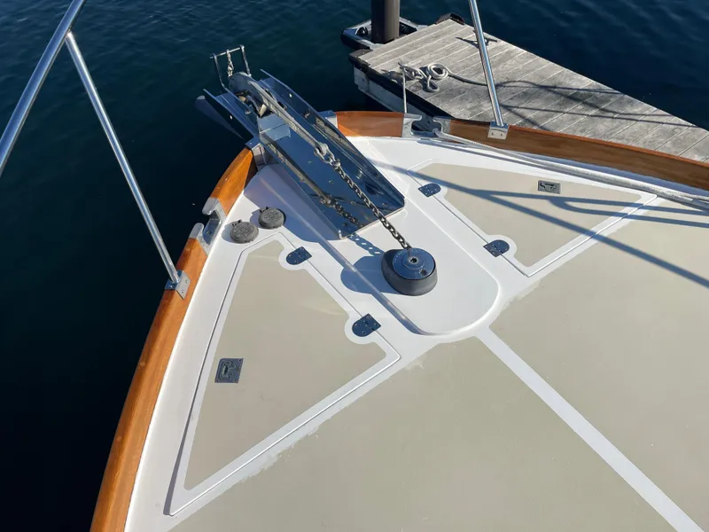 Slide: The Image of Bow of 2001 Grand Banks Eastbay 38 HX yacht with anchor and wooden trim. - 12